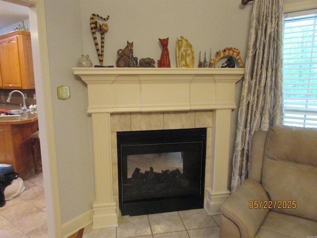 145 Eagles Nest Cv, Austin, AR 72007 - detailed view of a tiled fireplace, a sink, and baseboards