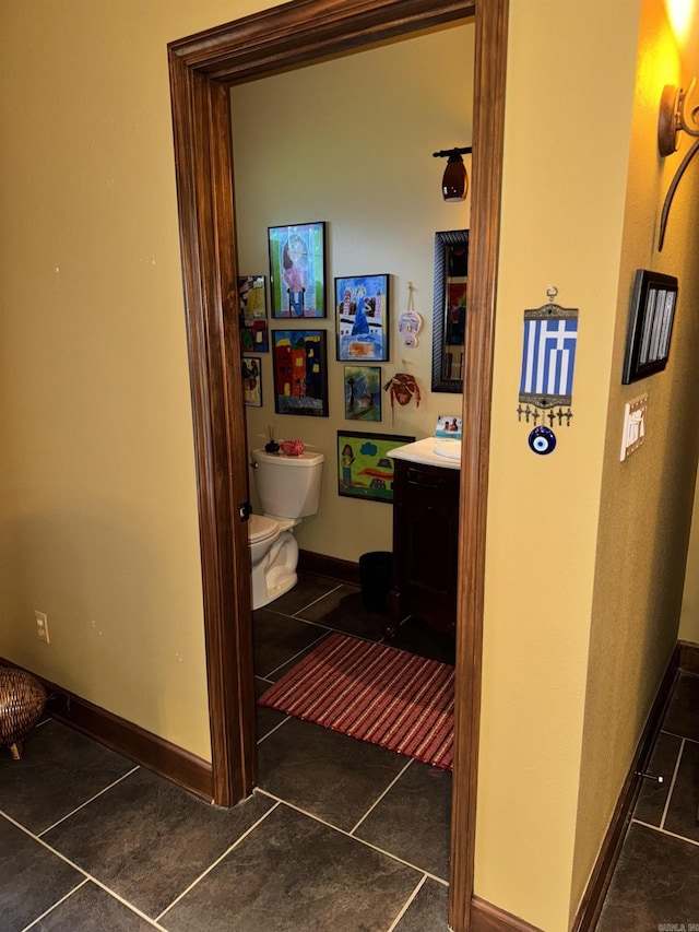 304 Quail Creek Rd, Hot Springs National Park, AR 71901 - half bathroom with tile patterned floors, vanity, toilet, and baseboards
