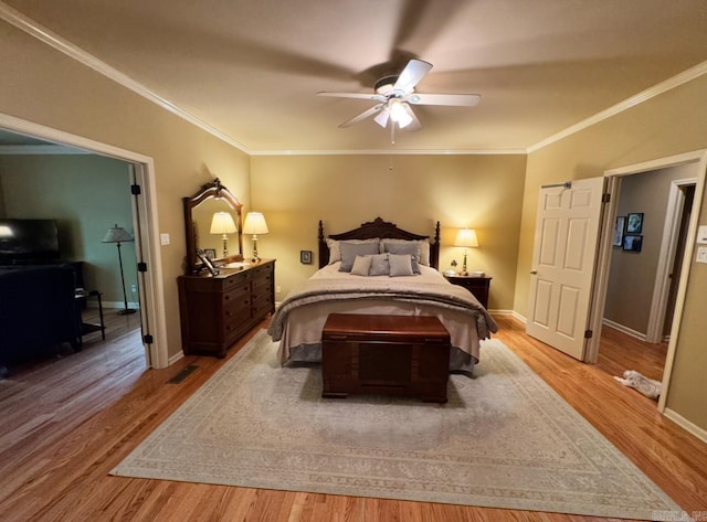 304 Quail Creek Rd, Hot Springs National Park, AR 71901 - bedroom featuring light wood finished floors, ornamental molding, baseboards, and ceiling fan