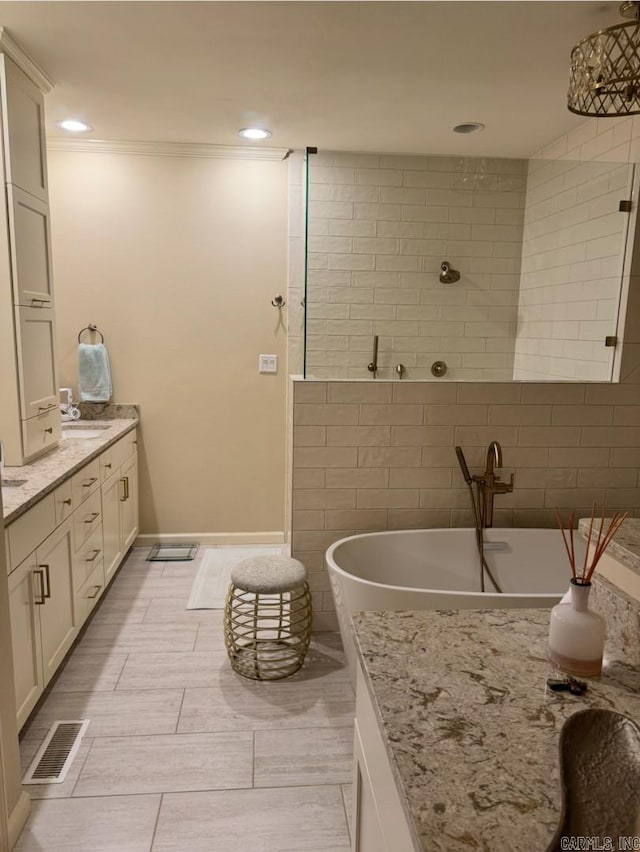 304 Quail Creek Rd, Hot Springs National Park, AR 71901 - bathroom featuring vanity, a freestanding tub, ornamental molding, and recessed lighting