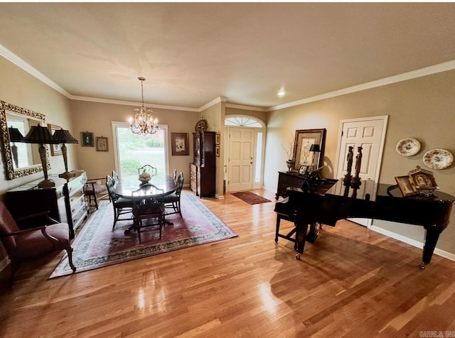 304 Quail Creek Rd, Hot Springs National Park, AR 71901 - dining space featuring a chandelier, light wood-style floors, baseboards, and ornamental molding