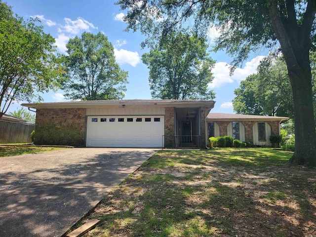 1008 W A Ave, North Little Rock, AR 72116 - view of front of property with concrete driveway, a garage, and stone siding