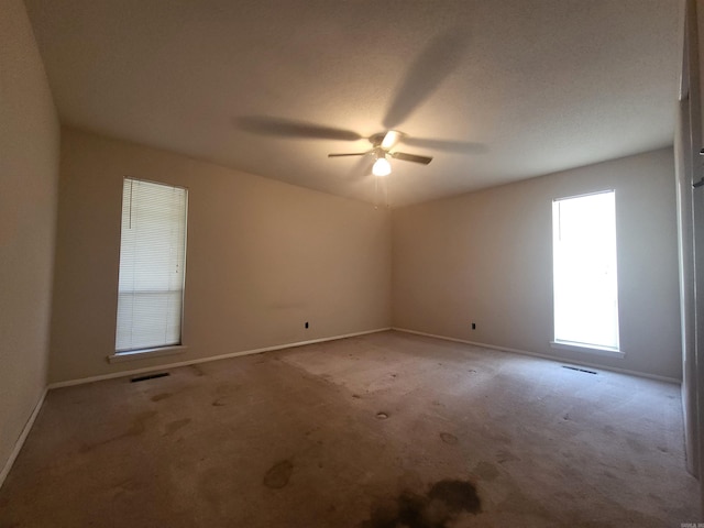 1008 W A Ave, North Little Rock, AR 72116 - carpeted empty room with a ceiling fan and baseboards