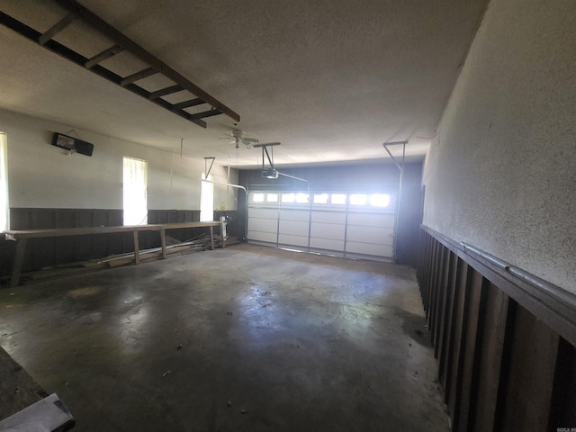 1008 W A Ave, North Little Rock, AR 72116 - garage with a textured wall and a garage door opener