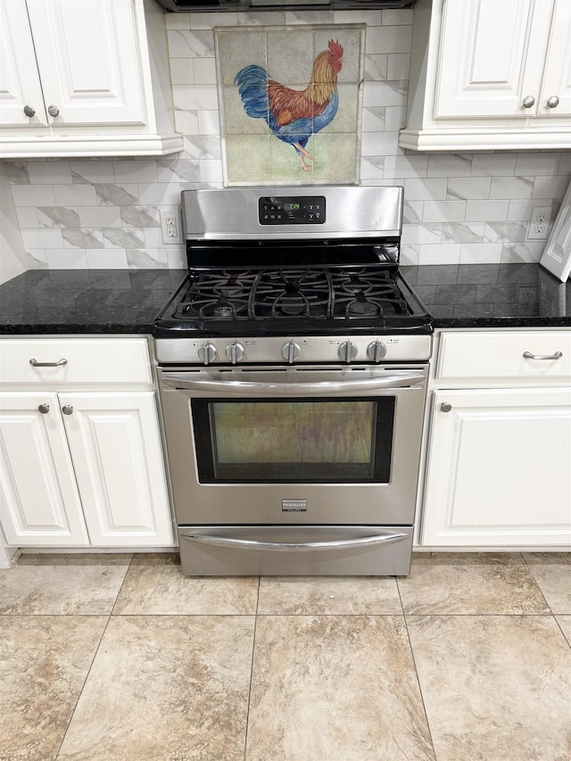 6484 N US Highway 61, Blytheville, AR 72315 - kitchen with stainless steel range with gas stovetop, white cabinets, tasteful backsplash, and dark stone countertops