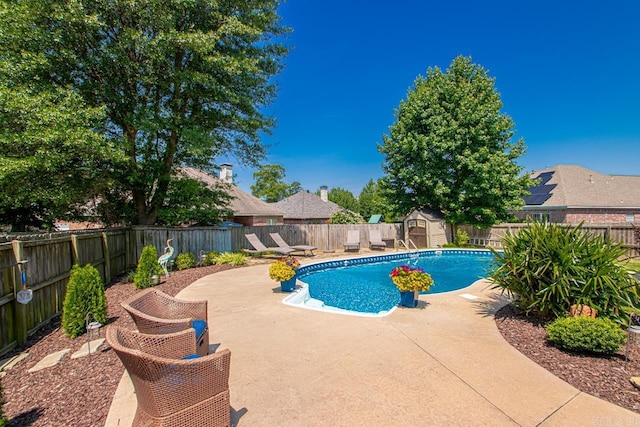 106 Hidden Falls Ln, Maumelle, AR 72113 - view of swimming pool featuring a storage unit, a patio, and a fenced backyard