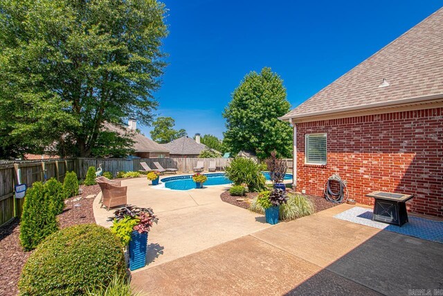 106 Hidden Falls Ln, Maumelle, AR 72113 - view of swimming pool with a fenced backyard and a patio