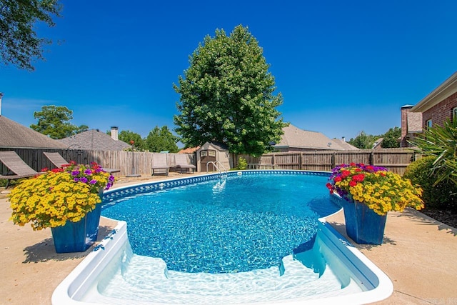 106 Hidden Falls Ln, Maumelle, AR 72113 - view of swimming pool with a storage unit and a fenced backyard