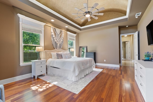 5526 Palisades Cv, Benton, AR 72019 - bedroom with a raised ceiling, wood finished floors, and recessed lighting