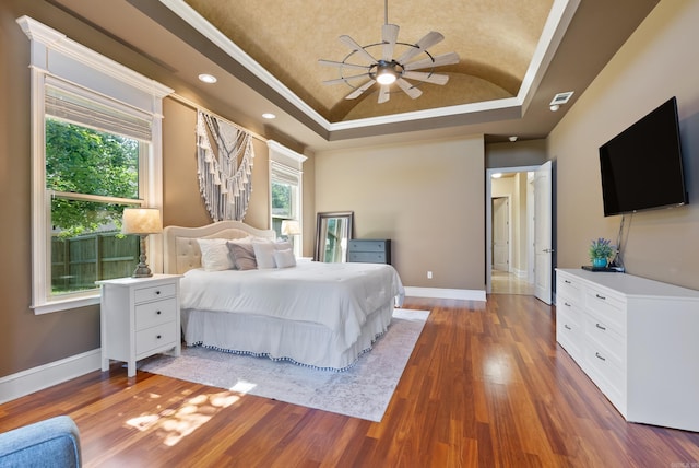 5526 Palisades Cv, Benton, AR 72019 - bedroom with a tray ceiling, wood finished floors, recessed lighting, crown molding, and a ceiling fan