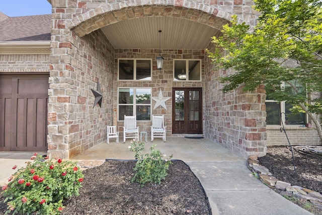 5526 Palisades Cv, Benton, AR 72019 - view of exterior entry with roof with shingles and brick siding