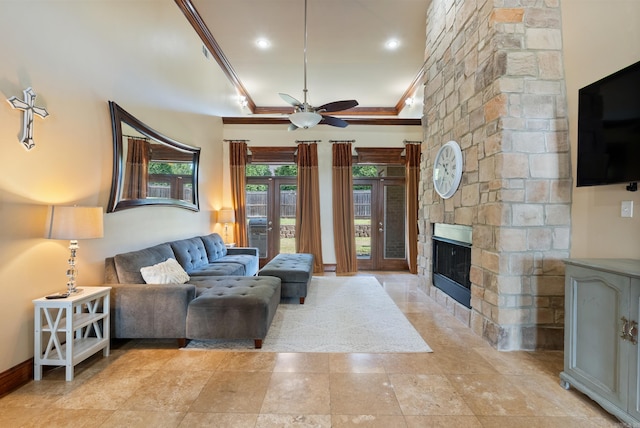 5526 Palisades Cv, Benton, AR 72019 - living area with ceiling fan, ornamental molding, and a stone fireplace