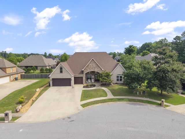 5526 Palisades Cv, Benton, AR 72019 - french provincial home with concrete driveway, a front lawn, and stone siding