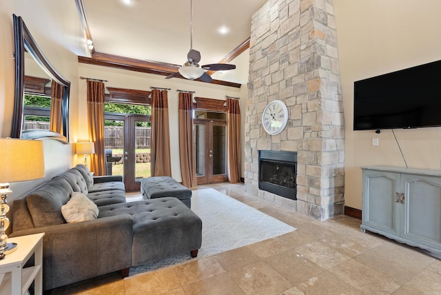 5526 Palisades Cv, Benton, AR 72019 - living area with a ceiling fan, crown molding, and a stone fireplace