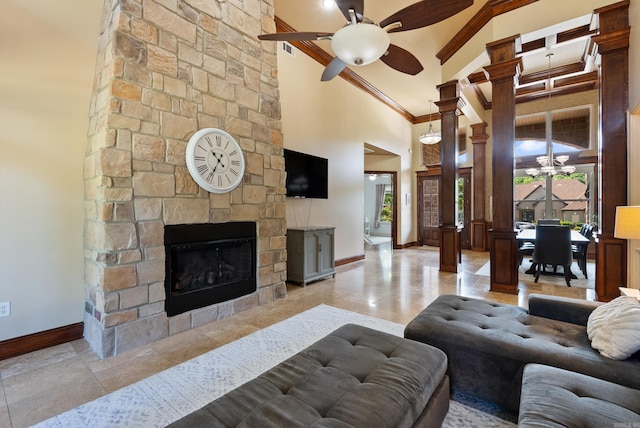 5526 Palisades Cv, Benton, AR 72019 - living room with ornamental molding, ceiling fan, a high ceiling, and a stone fireplace