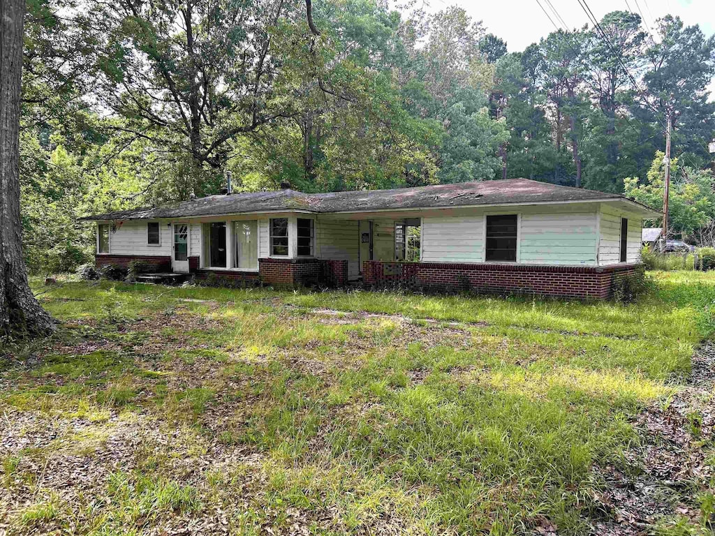 single story home with brick siding