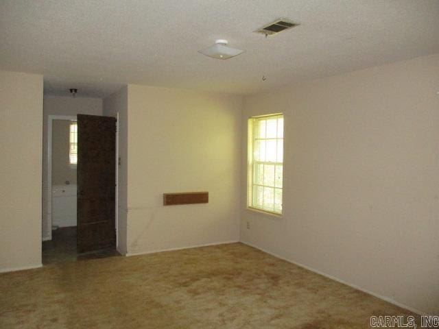 empty room with carpet flooring