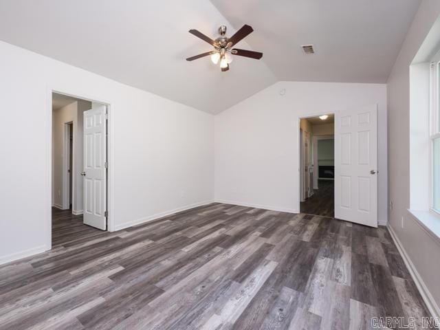 1121 Stewart St, Benton, AR 72015 - spare room with a ceiling fan, vaulted ceiling, and wood finished floors