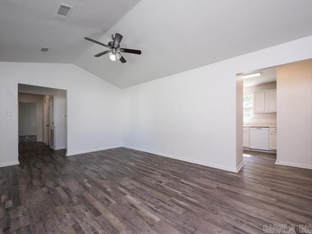 1121 Stewart St, Benton, AR 72015 - unfurnished living room featuring a ceiling fan, dark wood-style floors, and vaulted ceiling