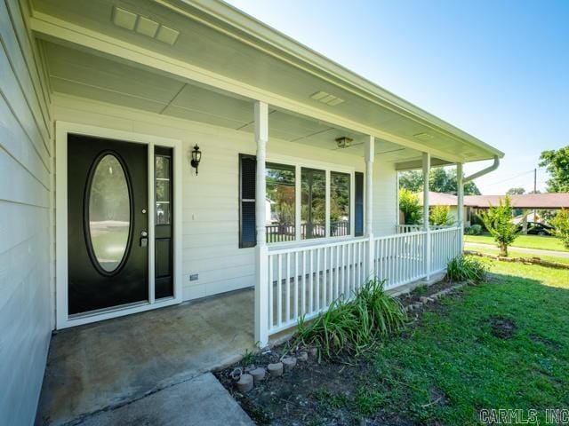 1121 Stewart St, Benton, AR 72015 - entrance to property featuring a porch and a lawn