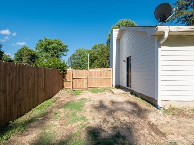 1121 Stewart St, Benton, AR 72015 - view of yard featuring a gate