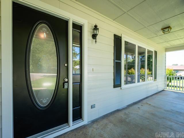 1121 Stewart St, Benton, AR 72015 - doorway to property with a porch