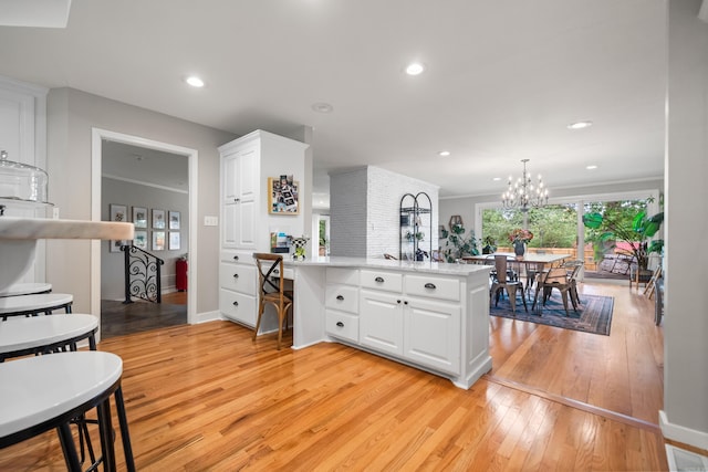 308 Bellaire, Hot Springs, AR 71901 - kitchen with white cabinets, light wood finished floors, a peninsula, light countertops, and recessed lighting