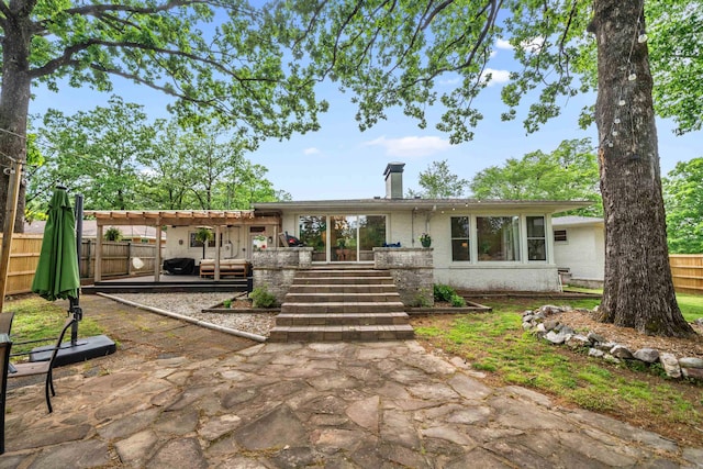 308 Bellaire, Hot Springs, AR 71901 - rear view of property featuring a fenced backyard, a pergola, a chimney, and a patio