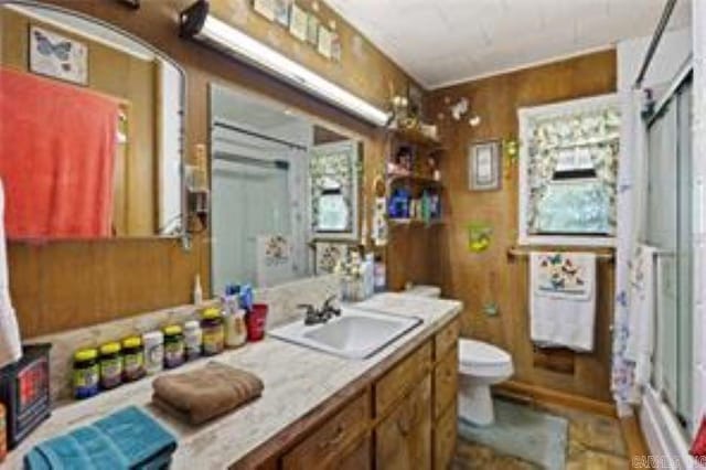 1440 N Shore Rd, Atkins, AR 72823 - full bathroom featuring vanity, a shower with shower door, and wooden walls