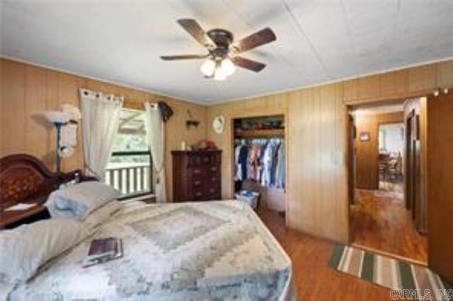 1440 N Shore Rd, Atkins, AR 72823 - bedroom featuring wood finished floors, a ceiling fan, and a closet