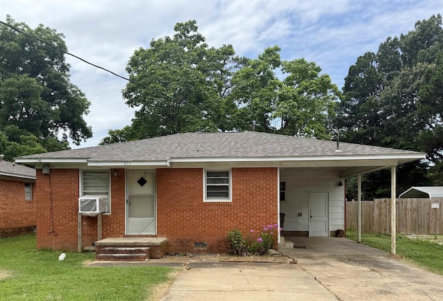 811 Hester St, Jonesboro, AR 72401 - view of front of house with concrete driveway, a carport, crawl space, a shingled roof, and brick siding