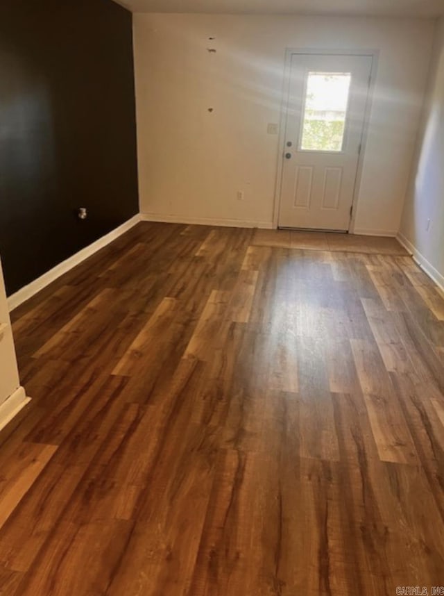 2 Concord Dr, Conway, AR 72034 - doorway to outside with dark wood finished floors and baseboards