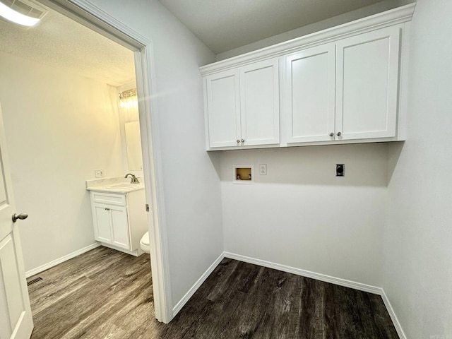 118 Lancaster, Mountain View, AR 72560 - laundry area featuring washer hookup, hookup for an electric dryer, and dark wood-style flooring