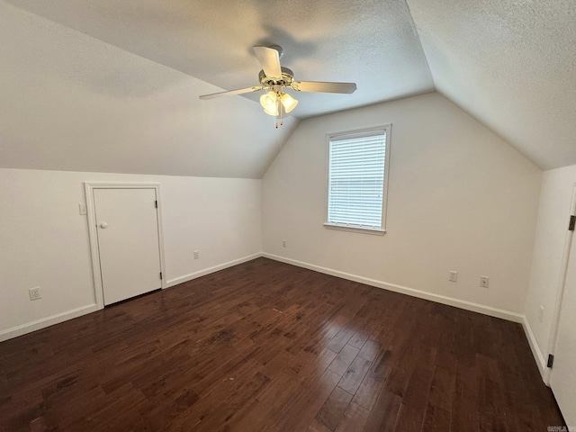 118 Lancaster, Mountain View, AR 72560 - bonus room featuring a ceiling fan, lofted ceiling, dark wood finished floors, and a textured ceiling