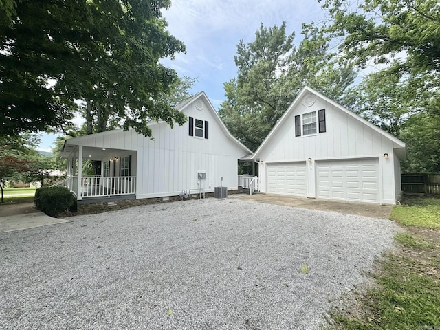 118 Lancaster, Mountain View, AR 72560 - view of home's exterior featuring a garage, driveway, a porch, and an outdoor structure
