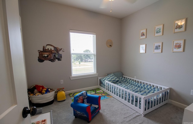 carpeted bedroom with baseboards