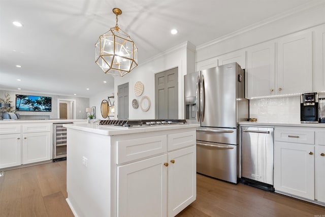 2904 Justin Matthews, North Little Rock, AR 72116 - kitchen featuring appliances with stainless steel finishes, wine cooler, ornamental molding, light wood finished floors, and recessed lighting