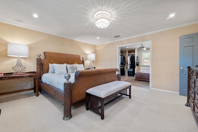 2904 Justin Matthews, North Little Rock, AR 72116 - bedroom featuring ornamental molding, light carpet, a chandelier, recessed lighting, and a walk in closet