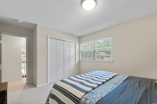 2904 Justin Matthews, North Little Rock, AR 72116 - carpeted bedroom with a textured ceiling and a closet