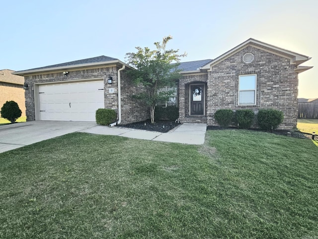 15 Marlin Dr, Austin, AR 72007 - ranch-style home featuring a front lawn, driveway, brick siding, and a garage