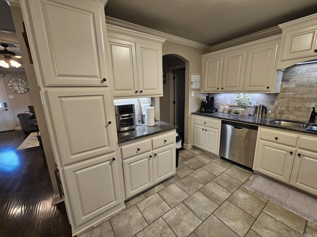 15 Marlin Dr, Austin, AR 72007 - kitchen with dishwasher, arched walkways, tasteful backsplash, a ceiling fan, and crown molding