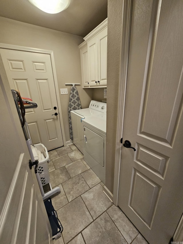 15 Marlin Dr, Austin, AR 72007 - washroom featuring independent washer and dryer, cabinet space, and light tile patterned floors