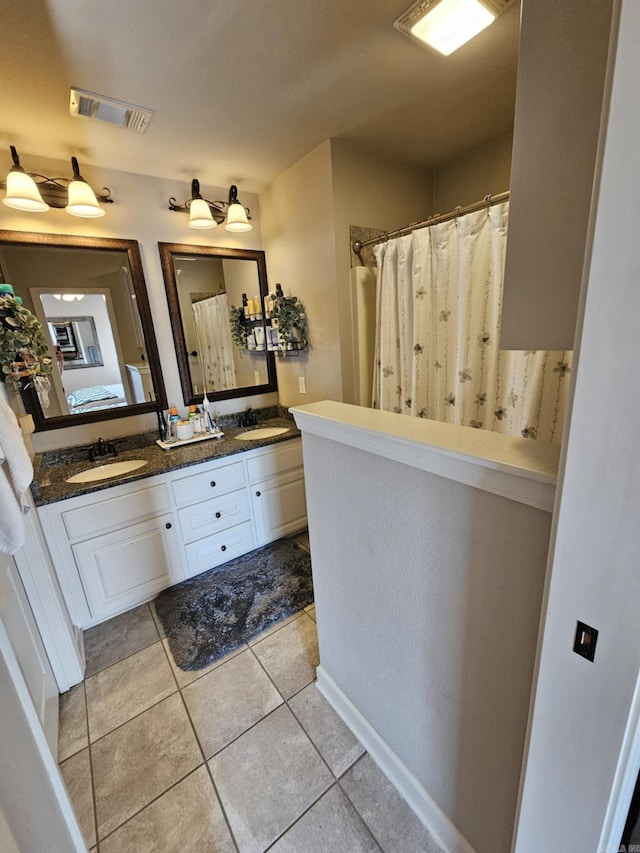15 Marlin Dr, Austin, AR 72007 - bathroom featuring tile patterned flooring, double vanity, and a shower with curtain