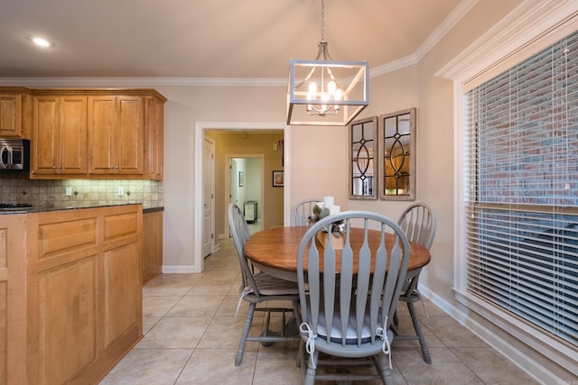 112 Holland Ln, Little Rock, AR 72223 - dining space featuring a chandelier, crown molding, and light tile patterned flooring