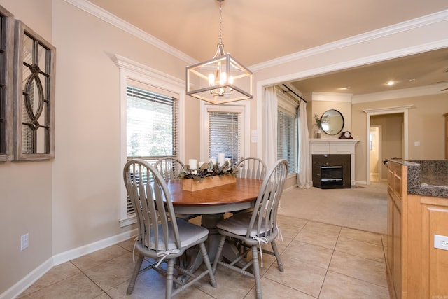 112 Holland Ln, Little Rock, AR 72223 - dining room with a chandelier, light tile patterned floors, a premium fireplace, crown molding, and light carpet