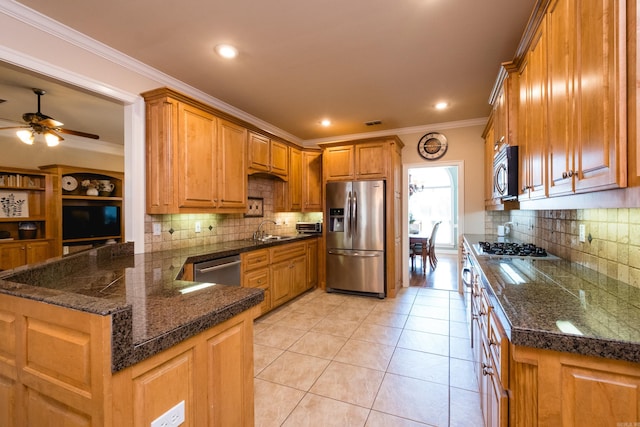 112 Holland Ln, Little Rock, AR 72223 - kitchen featuring stainless steel appliances, brown cabinets, tasteful backsplash, ceiling fan, and crown molding
