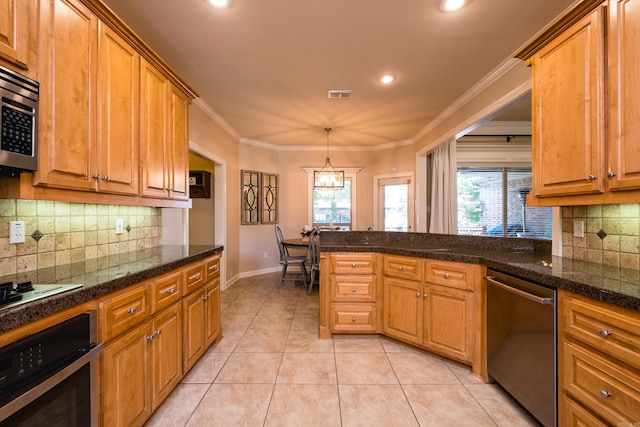 112 Holland Ln, Little Rock, AR 72223 - kitchen with stainless steel appliances, plenty of natural light, tasteful backsplash, brown cabinets, and recessed lighting