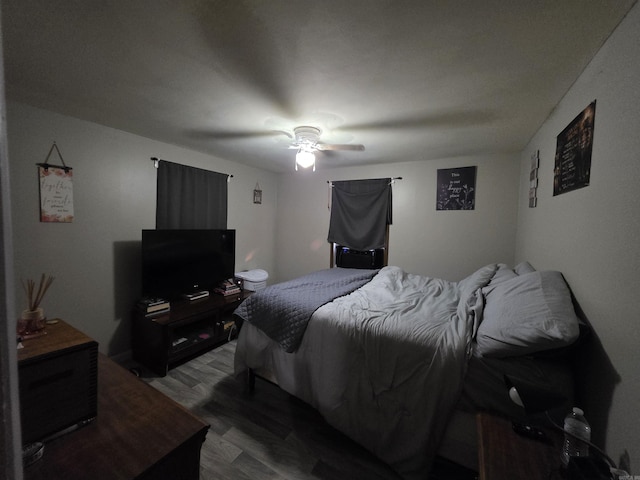 109 S Adams St, Mena, AR 71953 - bedroom with a ceiling fan and wood finished floors