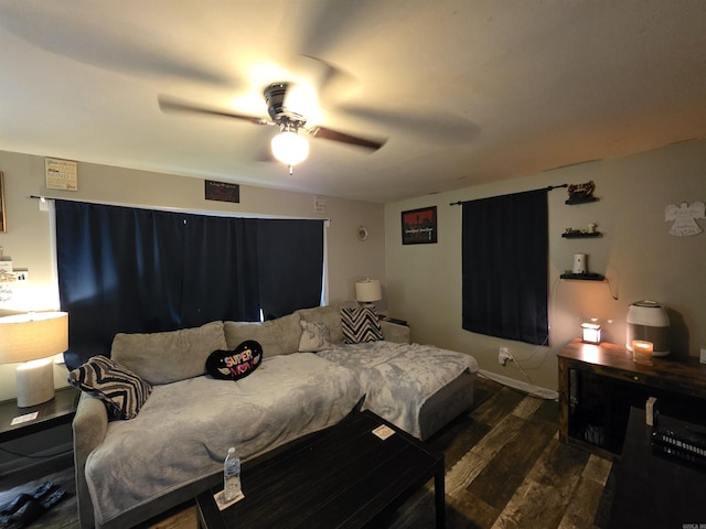 109 S Adams St, Mena, AR 71953 - bedroom featuring dark wood finished floors and a ceiling fan