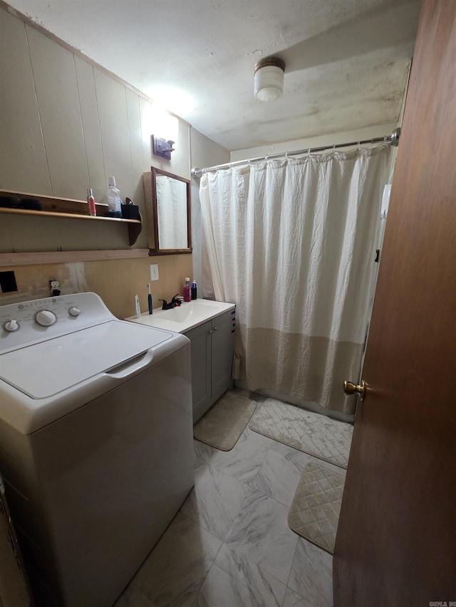 109 S Adams St, Mena, AR 71953 - washroom featuring washer / dryer and light marble finish flooring